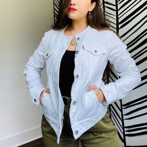 White denim Levi’s jacket.